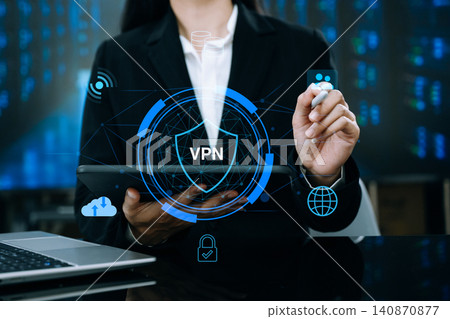 Business professional using tablet with VPN security shield interface in data center environment, representing cybersecurity, encrypted network connection Business professional using tablet with VPN security shield interface in data center environment, representing cybersecurity, encrypted network connection 140870877