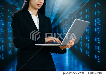 IT professional managing servers in data center, showcasing cloud computing, network infrastructure, cybersecurity IT professional managing servers in data center, showcasing cloud computing, network infrastructure, cybersecurity 140870903