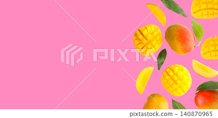Fresh mangoes and luscious slices scattered on bright pink backdrop Fresh mangoes and luscious slices scattered on bright pink backdrop 140870965