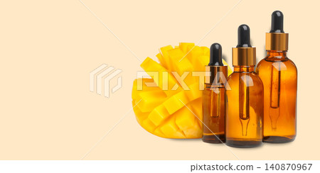 Ripe mango next to essential oil bottles create refreshing scene Ripe mango next to essential oil bottles create refreshing scene 140870967