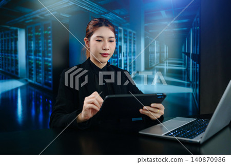 Business woman using tablet and laptop for doing math finance on an office desk, tax, report, accounting, statistics, and analytical research concept Business woman using tablet and laptop for doing math finance on an office desk, tax, report, accounting, statistics, and analytical research concept 140870986