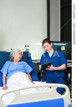A professional nurse provides care and support to an elderly Asian woman in a hospital bed, representing geriatric healthcare, patient comfort, and medical wellness services. A professional nurse provides care and support to an elderly Asian woman in a hospital bed, representing geriatric healthcare, patient comfort, and medical wellness services. 140871251