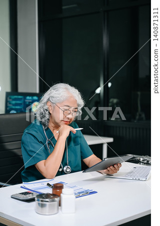 Doctor in online consultation discussing patient treatment via laptop, highlighting telemedicine, healthcare communication, diagnosis Doctor in online consultation discussing patient treatment via laptop, highlighting telemedicine, healthcare communication, diagnosis 140871311