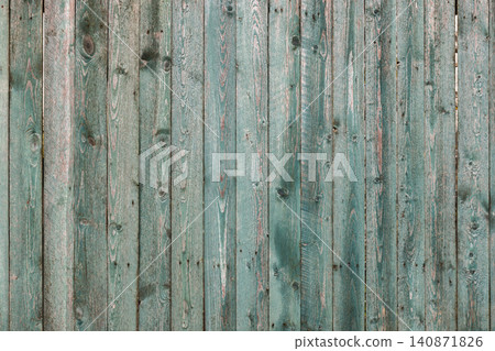 Weathered teal wooden fence with vertical planks, photo texture 140871826