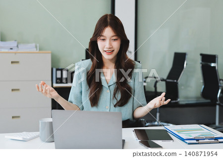 Businesswoman working with tablet and financial reports in modern office 140871954