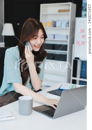 Businesswoman working with tablet and financial reports in modern office Businesswoman working with tablet and financial reports in modern office 140871957