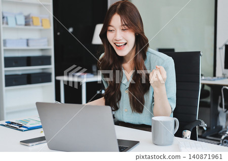 Businesswoman working with tablet and financial reports in modern office Businesswoman working with tablet and financial reports in modern office 140871961