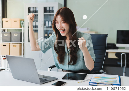 Businesswoman working with tablet and financial reports in modern office Businesswoman working with tablet and financial reports in modern office 140871962