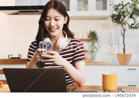 Asian woman using computer remote for business studying, watching online virtual webinar training meeting, video call. asian business woman talking on laptop in home office. Banner, copy space Asian woman using computer remote for business studying, watching online virtual webinar training meeting, video call. asian business woman talking on laptop in home office. Banner, copy space 140872034