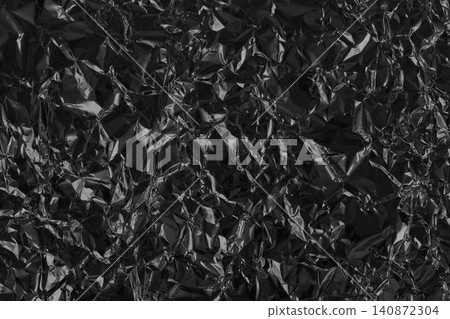 Shiny black grey foil metal texture, abstract wrapping paper for background and design art work. Shiny black grey foil metal texture, abstract wrapping paper for background and design art work. 140872304