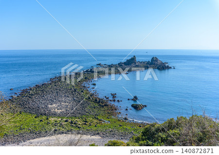 The breathtaking scenery of Mitsuishi Coast on the Manazuru Peninsula under a clear sky, and the rocky areas covered in green moss. The breathtaking scenery of Mitsuishi Coast on the Manazuru Peninsula under a clear sky, and the rocky areas covered in green moss. 140872871