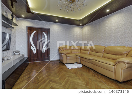 Spacious Apartment Living Room Interior with Large Leather Corner Sofa Spacious Apartment Living Room Interior with Large Leather Corner Sofa 140873146