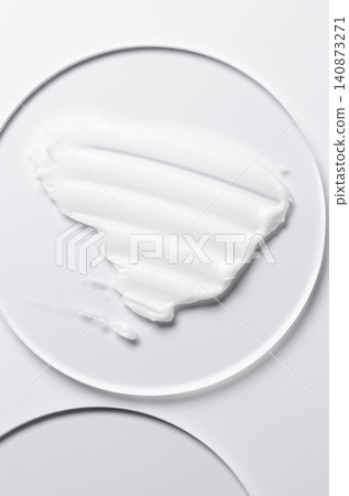 A sample of a cosmetic product. A moisturizing gel or shaving cream or body milk. A sample of a cosmetic product. A moisturizing gel or shaving cream or body milk. 140873271