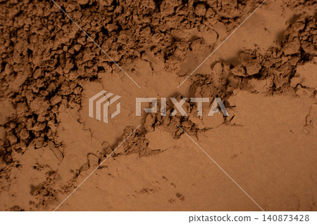 Abstract culinary background with organic cocoa powder waves Abstract culinary background with organic cocoa powder waves 140873428