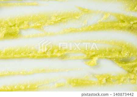 Creative strokes and smears of healthy guacamole sauce isolated on white backdrop Creative strokes and smears of healthy guacamole sauce isolated on white backdrop 140873442