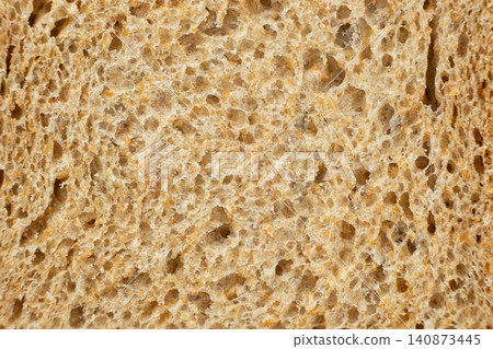 Full frame view of fresh baked porous rye bread structure close-up Full frame view of fresh baked porous rye bread structure close-up 140873445