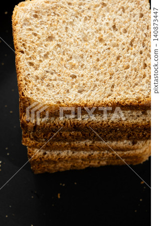 Crunchy roasted rye bread slices stacked together, healthy food concept. Crunchy roasted rye bread slices stacked together, healthy food concept. 140873447