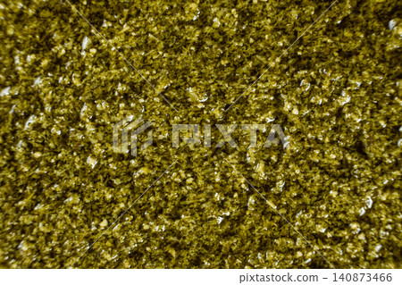 Close-up texture of fresh green pesto sauce with olive oil Close-up texture of fresh green pesto sauce with olive oil 140873466