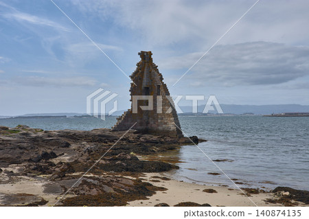 The ruins of the Tower of San Sadurnino rise above the sea on the islet of A Figueira, Cambados, Galicia The ruins of the Tower of San Sadurnino rise above the sea on the islet of A Figueira, Cambados, Galicia 140874135