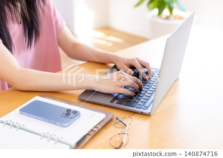 Women handling personal computers Women handling personal computers 140874716