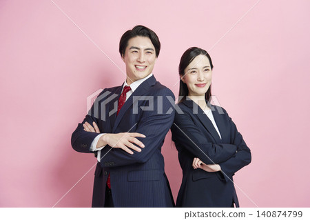 Portraits of a businessman and businesswoman against a pink background. Portraits of a businessman and businesswoman against a pink background. 140874799