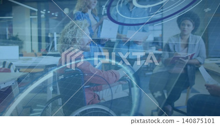 Leading man in wheelchair wearing rust jacket guiding team meeting at open office, with AR graphics Leading man in wheelchair wearing rust jacket guiding team meeting at open office, with AR graphics 140875101