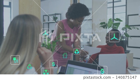 Leaning woman in pink dress showing paper to colleague in red turtleneck at desk, plants icons Leaning woman in pink dress showing paper to colleague in red turtleneck at desk, plants icons 140875147