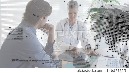 Pointing clinician in white coat and patient in shirt examining scan at clinic desk, stethoscope Pointing clinician in white coat and patient in shirt examining scan at clinic desk, stethoscope 140875225