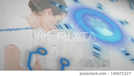 Leaning spa therapist wearing white tunic examining table with rolled towels and HUD, copy space Leaning spa therapist wearing white tunic examining table with rolled towels and HUD, copy space 140875227