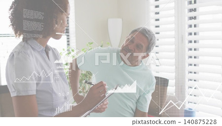 Standing caregiver with clipboard recording at home while senior holding back, charts overlaying Standing caregiver with clipboard recording at home while senior holding back, charts overlaying 140875228