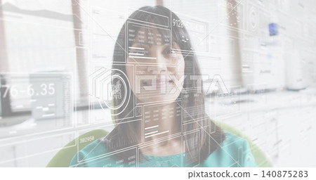 Interacting mature woman wearing teal top navigating AR dashboard at office, with monitor cabinets Interacting mature woman wearing teal top navigating AR dashboard at office, with monitor cabinets 140875283