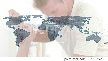 Leaning man in light polo comforting woman in light top at home, with world map overlay Leaning man in light polo comforting woman in light top at home, with world map overlay 140875285