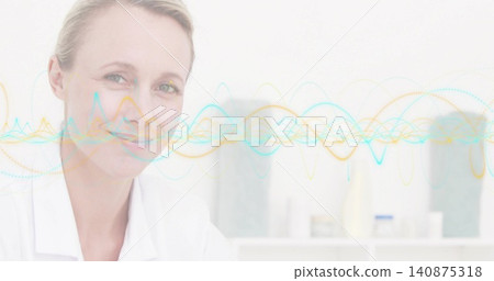 Smiling female clinician wearing white lab coat facing camera at clinic with waveform overlay Smiling female clinician wearing white lab coat facing camera at clinic with waveform overlay 140875318