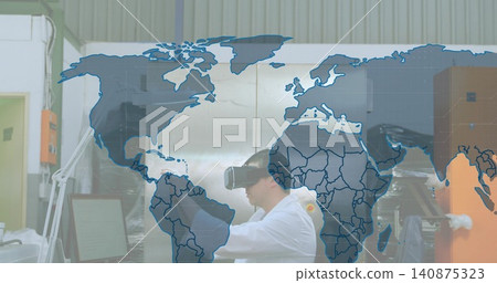 Testing researcher wearing white lab coat and VR headset at workbench with monitor, orange machine Testing researcher wearing white lab coat and VR headset at workbench with monitor, orange machine 140875323
