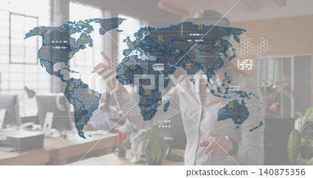 Reaching man in white button-down shirt touching digital world map overlay at office, with monitors Reaching man in white button-down shirt touching digital world map overlay at office, with monitors 140875356