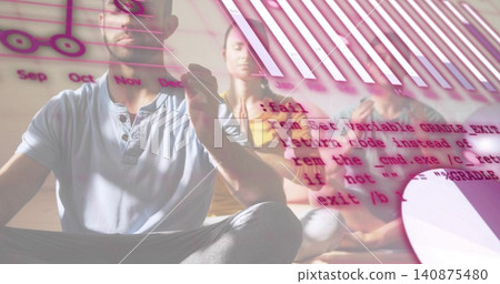 Raising hand near clear panel, man in gray shirt meditating on mat at studio, with charts Raising hand near clear panel, man in gray shirt meditating on mat at studio, with charts 140875480