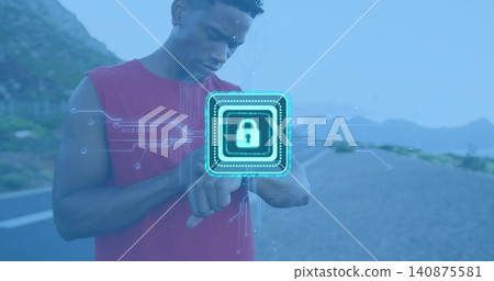 Standing male in red sleeveless top checking smartwatch left-wrist at paved road, hologram padlock Standing male in red sleeveless top checking smartwatch left-wrist at paved road, hologram padlock 140875581