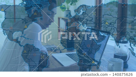 Working mature adults leaning forward, typing on laptop at wood table near window, with map overlay Working mature adults leaning forward, typing on laptop at wood table near window, with map overlay 140875626