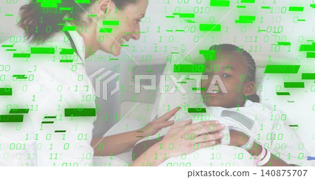 Smiling clinician in white coat leaning over child at bedside, with gown, wristband, green overlay Smiling clinician in white coat leaning over child at bedside, with gown, wristband, green overlay 140875707