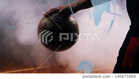 Resting basketball player holding ball on wooden court, in dark red-panel kit, blue fog overlays Resting basketball player holding ball on wooden court, in dark red-panel kit, blue fog overlays 140875869