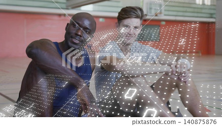 Sitting two men wearing athletic shirts and shorts, resting on gym court with holographic grid Sitting two men wearing athletic shirts and shorts, resting on gym court with holographic grid 140875876