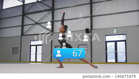 Performing lunge, adult female athlete wearing sequined leotard on rink, showing blue 67 overlay Performing lunge, adult female athlete wearing sequined leotard on rink, showing blue 67 overlay 140875879