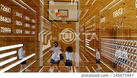 Playing kids in white shirts dribbling basketball by hoop in school gym, with digital overlays Playing kids in white shirts dribbling basketball by hoop in school gym, with digital overlays 140875947