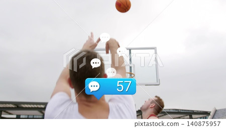 Shooting in white top on outdoor court with red defender, ball arcing to rim, badge 57 Shooting in white top on outdoor court with red defender, ball arcing to rim, badge 57 140875957