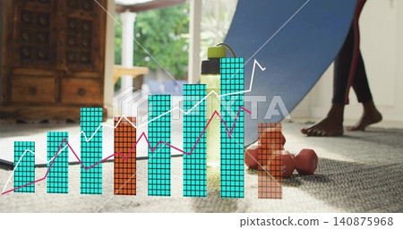 Moving woman in leggings placing rolled blue mat on home carpet, yellow bottle, weights, chart Moving woman in leggings placing rolled blue mat on home carpet, yellow bottle, weights, chart 140875968