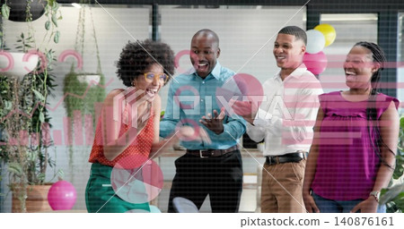 Celebrating coworkers wearing bright tops, clapping and smiling at office glass partition, balloons Celebrating coworkers wearing bright tops, clapping and smiling at office glass partition, balloons 140876161