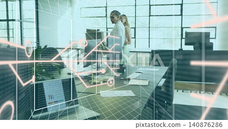 Reviewing code, two colleagues in business casual at open office, with laptop, monitors, AR overlay Reviewing code, two colleagues in business casual at open office, with laptop, monitors, AR overlay 140876286