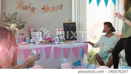 Sitting pregnant woman in green dress cradling belly at home, with cupcakes, chalkboard, copy space Sitting pregnant woman in green dress cradling belly at home, with cupcakes, chalkboard, copy space 140876297