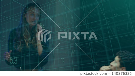 Presenting mid adult woman pointing at teal 3D data grid in office meeting, wearing dark blazer Presenting mid adult woman pointing at teal 3D data grid in office meeting, wearing dark blazer 140876325
