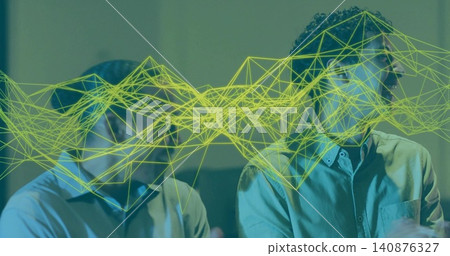 Glancing right man with curly hair wearing collared shirt in meeting, neon wireframe mesh overlay Glancing right man with curly hair wearing collared shirt in meeting, neon wireframe mesh overlay 140876327